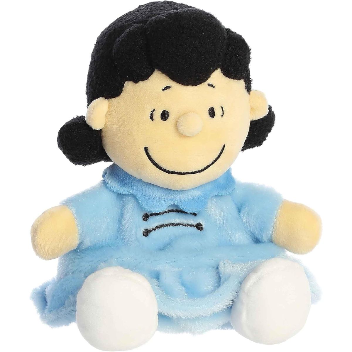Aurora 5-inch Palm Pals Peanuts Lucy plush toy sitting forward showing her light blue dress, jet-black hair with signature flips, white shoes, and a wide stitched smile.