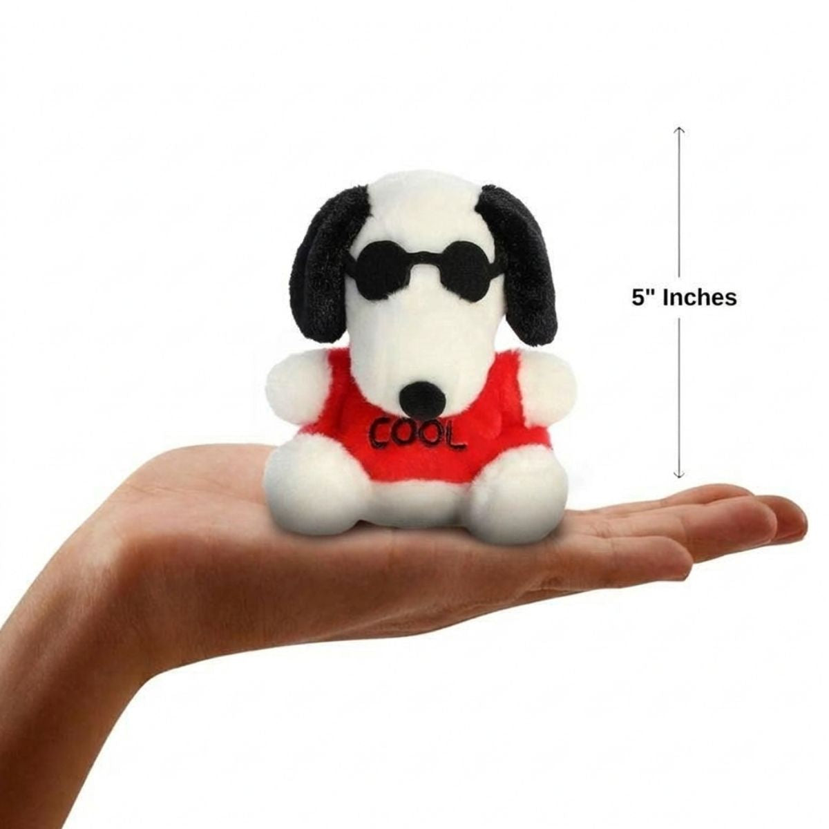 The miniature Snoopy Joe Cool plush sitting balanced in an open human hand under a 5-inch height graphic indicator.