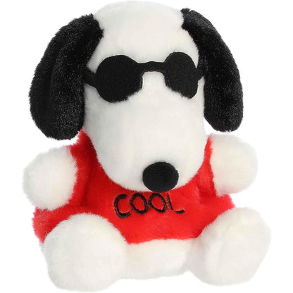 Aurora 5-inch Palm Pals Peanuts Snoopy Joe Cool plush toy sitting forward showing his white fur, floppy black ears, cool black sunglasses, and a red t-shirt.