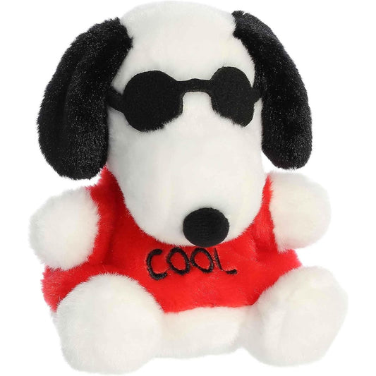 Aurora 5-inch Palm Pals Peanuts Snoopy Joe Cool plush toy sitting forward showing his white fur, floppy black ears, cool black sunglasses, and a red t-shirt.