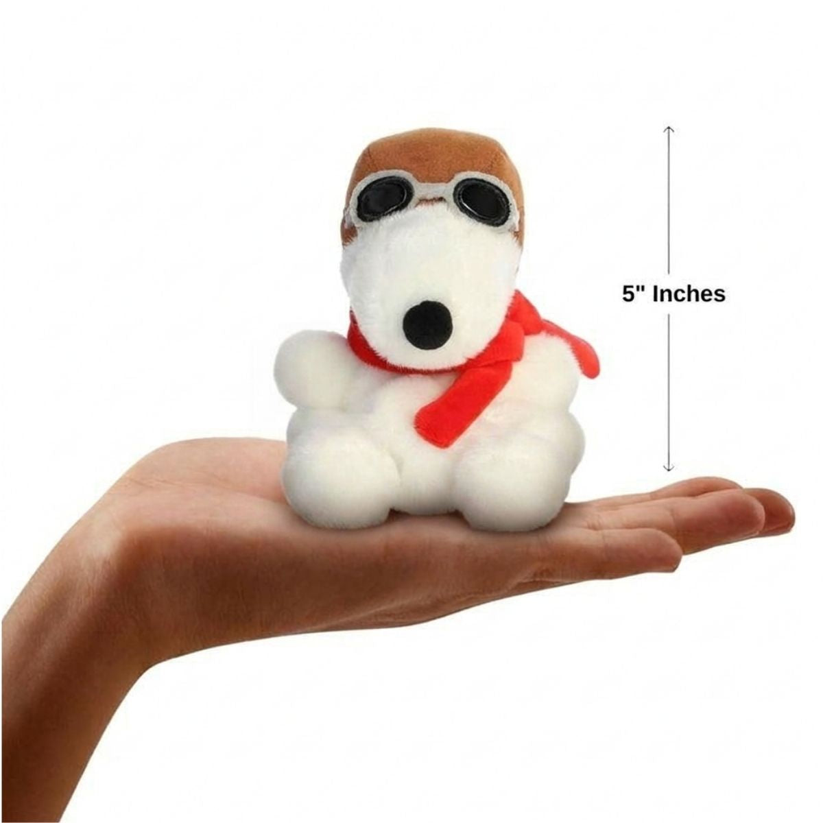 The miniature Snoopy Flying Ace plush sitting balanced in an open human hand under a 5-inch height graphic indicator.