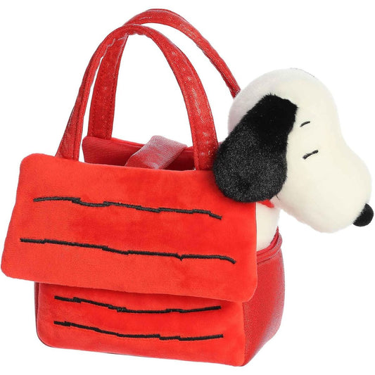 Angled view of the adorable Snoopy stuffed animal sitting comfortably inside his red doghouse carrier bag.