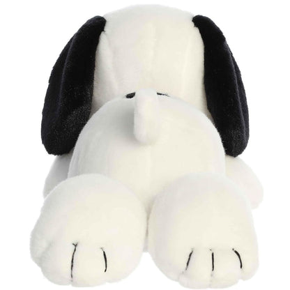 Direct back view of the Snoopy stuffed animal lying down, highlighting the bottom of his stitched paws and little white tail.