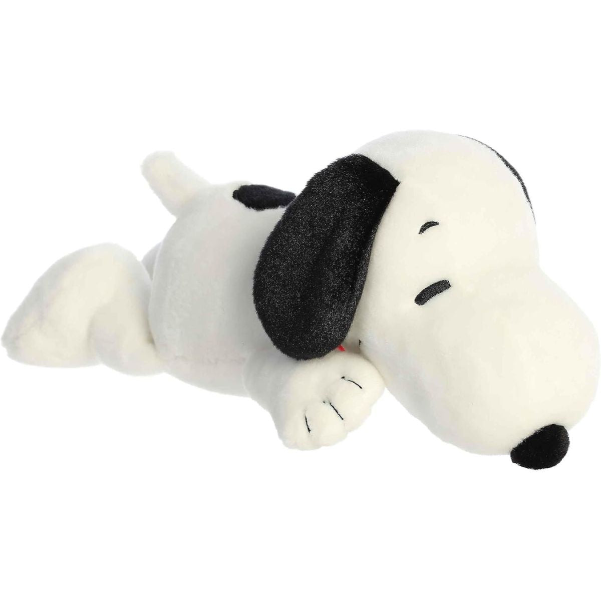 Angled front view of the 11.5-inch Aurora Peanuts Laying Snoopy stuffed animal resting comfortably on his stomach.