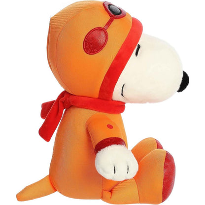 Side profile view of the Astronaut Snoopy plush showing his seated posture, fluffy white tail, and the red scarf tied around his neck.