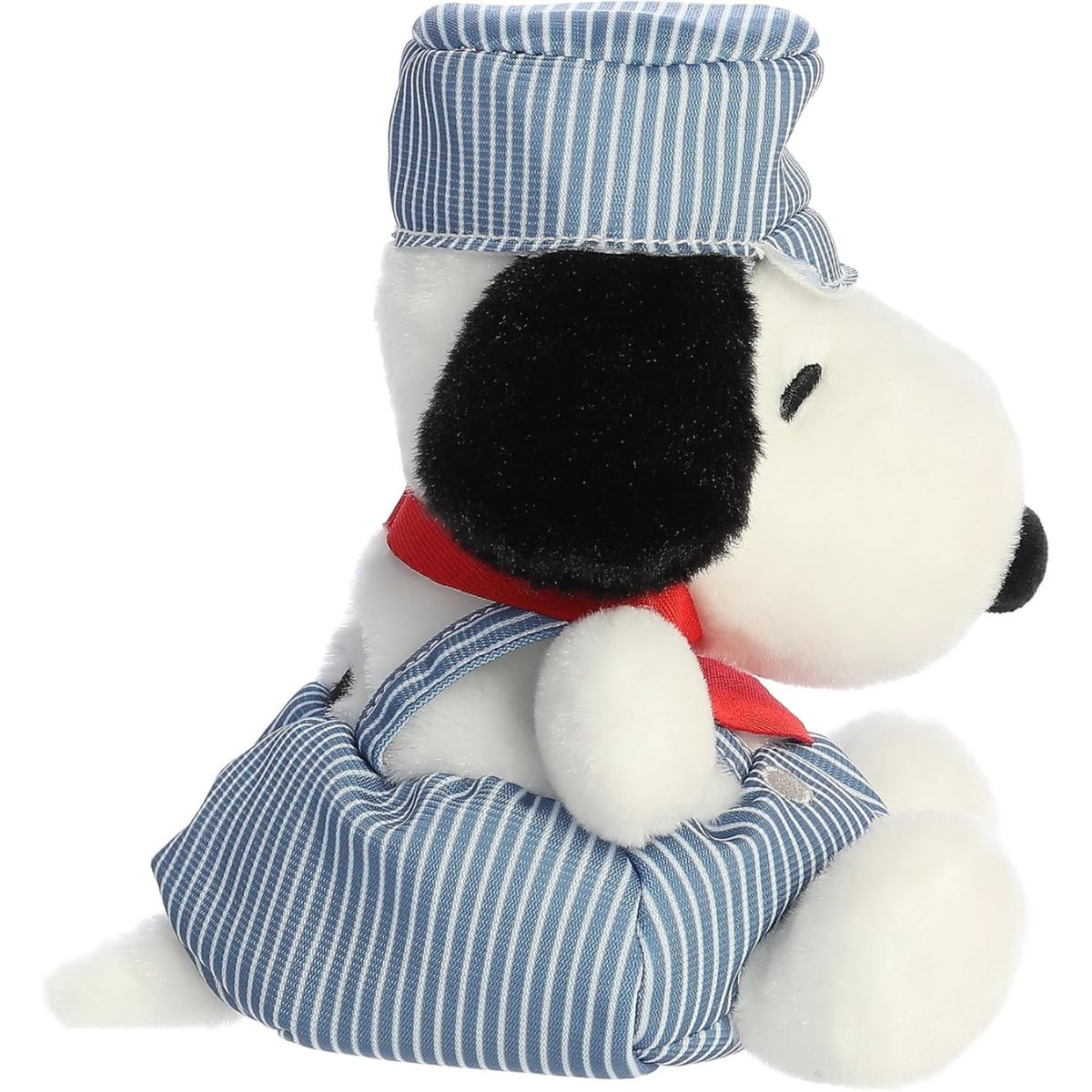 Side profile view of the cuddly Palm Pals Snoopy plush sitting comfortably, highlighting his red bandana and striped engineer hat.