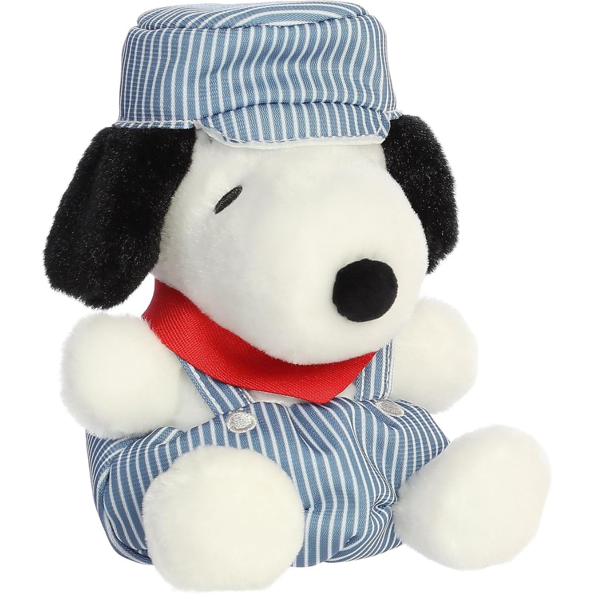 Angled front view of the 5-inch Aurora Palm Pals Peanuts Train Engineer Snoopy stuffed animal sitting down wearing striped overalls, a matching hat, and a red neckerchief.