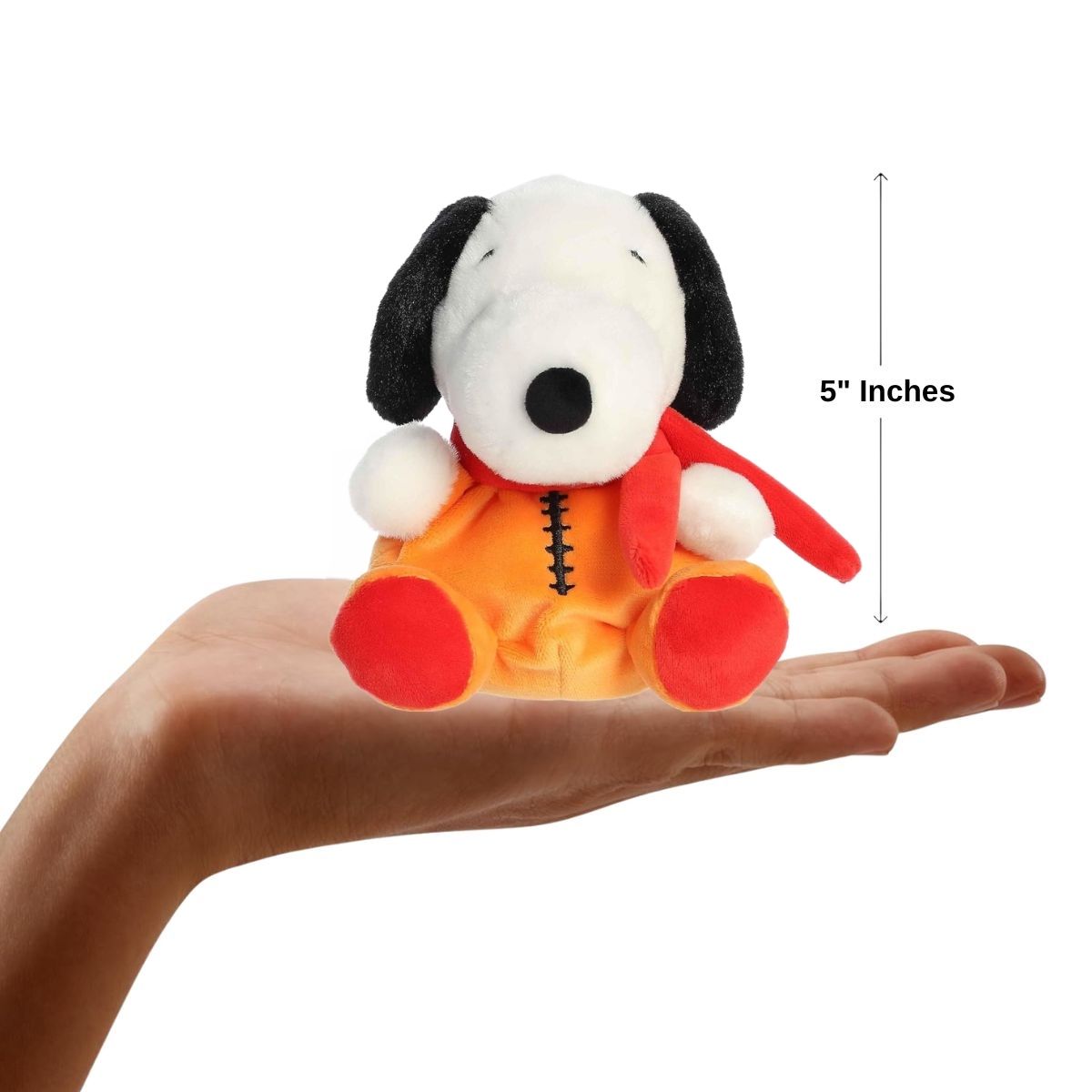 The miniature Astronaut Snoopy plush sitting inside an open human hand displaying a 5-inch height indicator graphic.