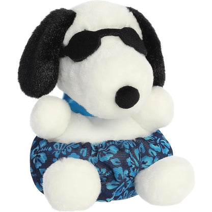 Aurora Palm Pals Surfer Snoopy 5-inch plush stuffed toy sitting forward wearing black sunglasses and blue tropical floral swim trunks.