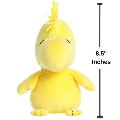 Scale graphic showing the Aurora Woodstock plush sitting straight forward next to a measurement line to demonstrate its 8.5-inch height.