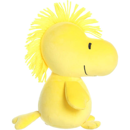 Side profile view of the squishy Woodstock plush highlighting his plump shape, little wings, and tufted yellow hair.
