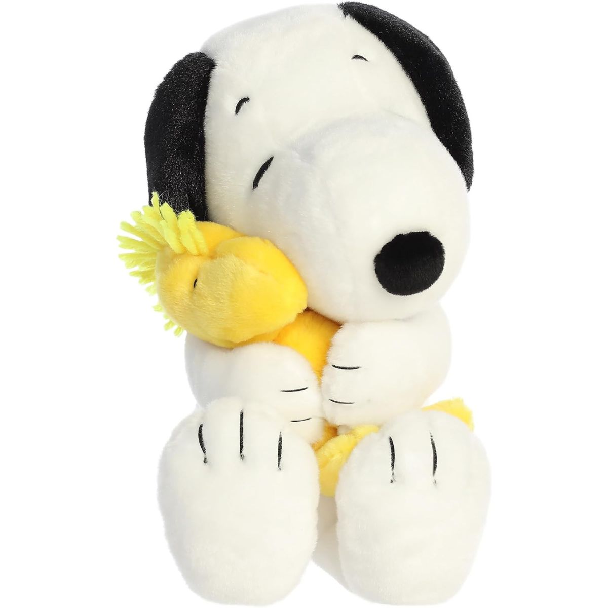 Straight-on front view of the soft Snoopy plush sitting upright with his eyes closed, hugging a yellow Woodstock plush.