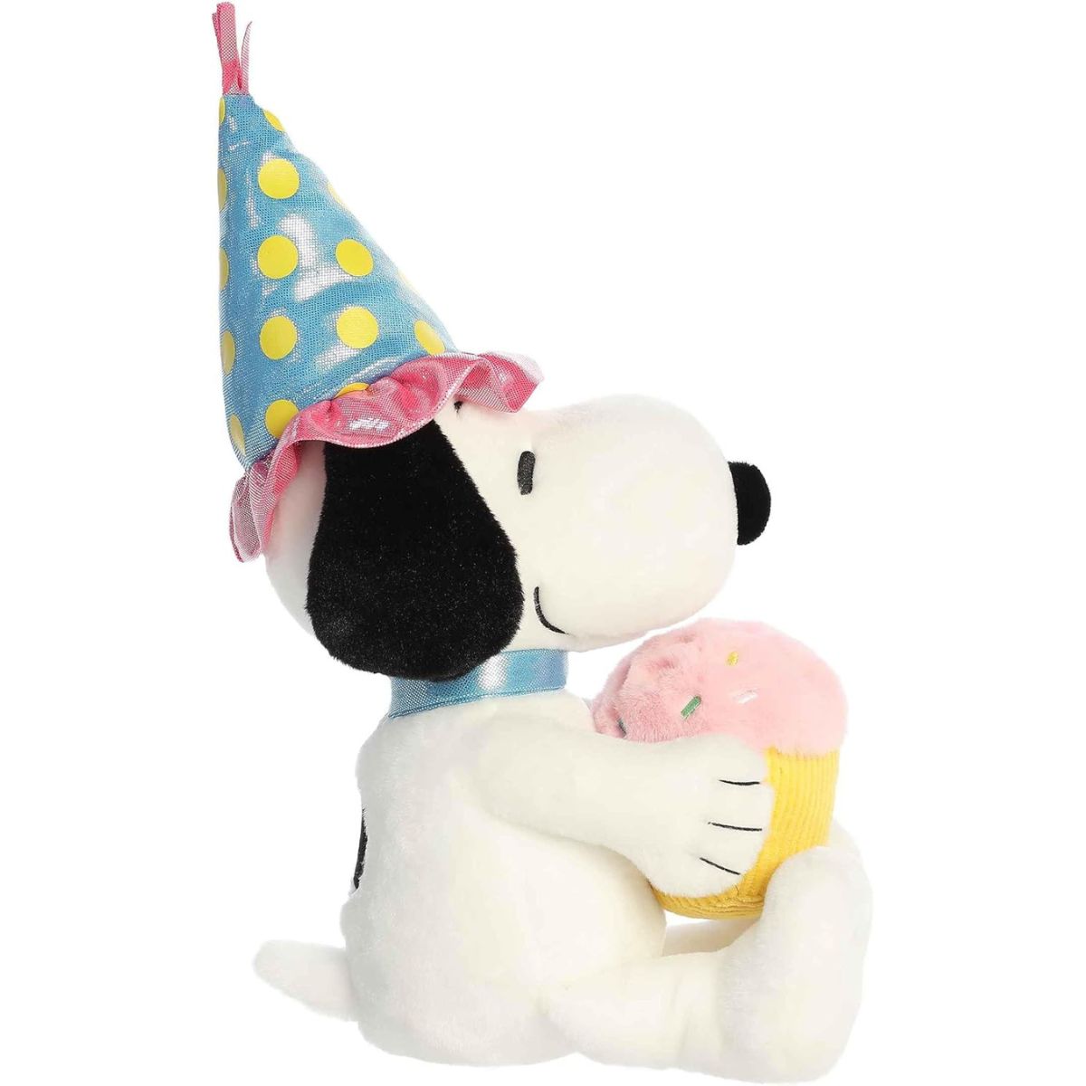 Side profile view of the cuddly Snoopy plush sitting comfortably, highlighting his party hat and light blue collar.