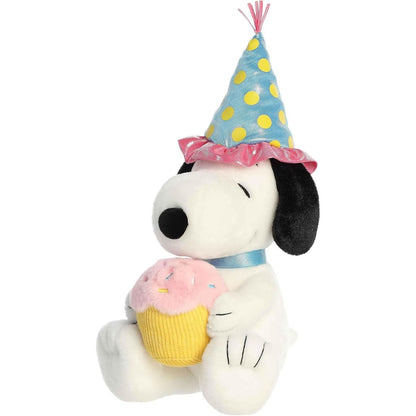 Slightly angled front right view of the festive Snoopy stuffed animal holding his cupcake.