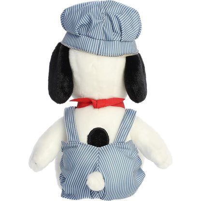 Direct back view of the Snoopy stuffed animal sitting down, highlighting his striped overalls and little white tail.