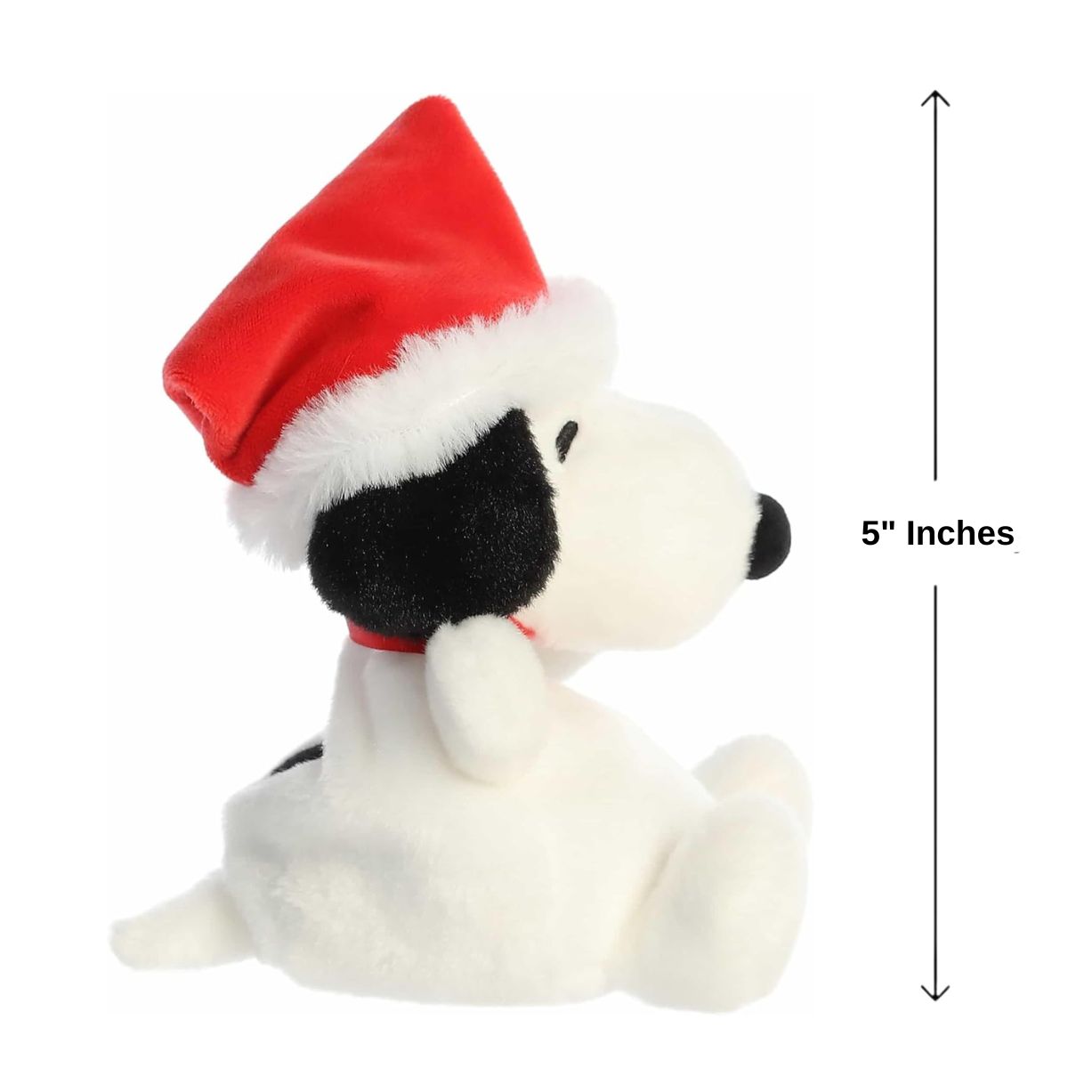 The right side profile view of the miniature Santa Snoopy plush sitting inside an open human hand displaying a 5-inch height indicator graphic.