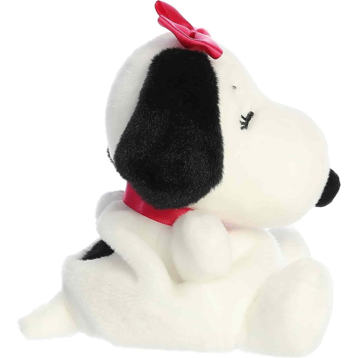 Side profile view of the Palm Pals Belle highlighting her plump shape, black floppy ear, and pretty pink bow.