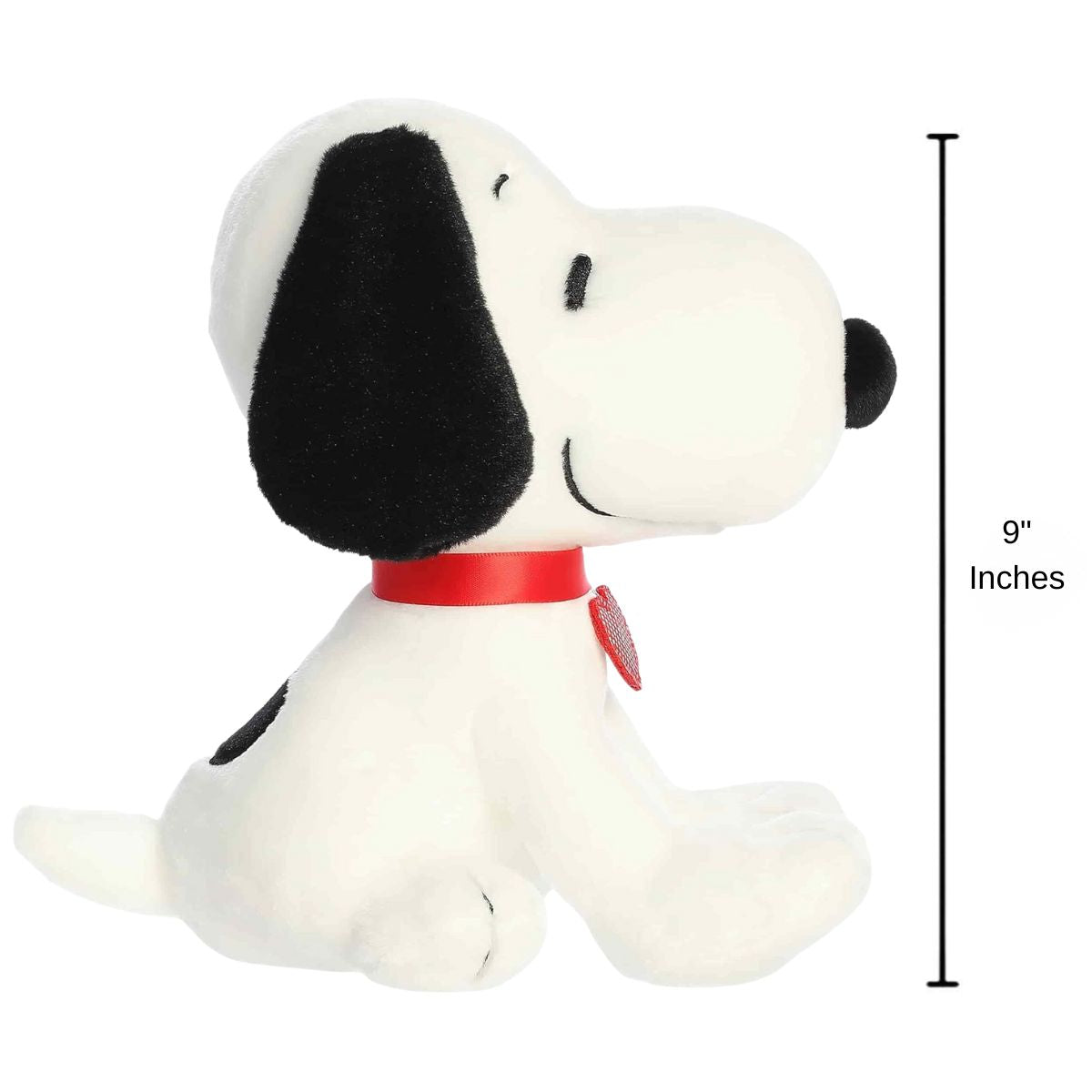 Side profile view thumbnail of the Snoopy plush sitting upright, showing his snout, short tail, red heart tag, and a 9-inch height measurement graphic indicator.