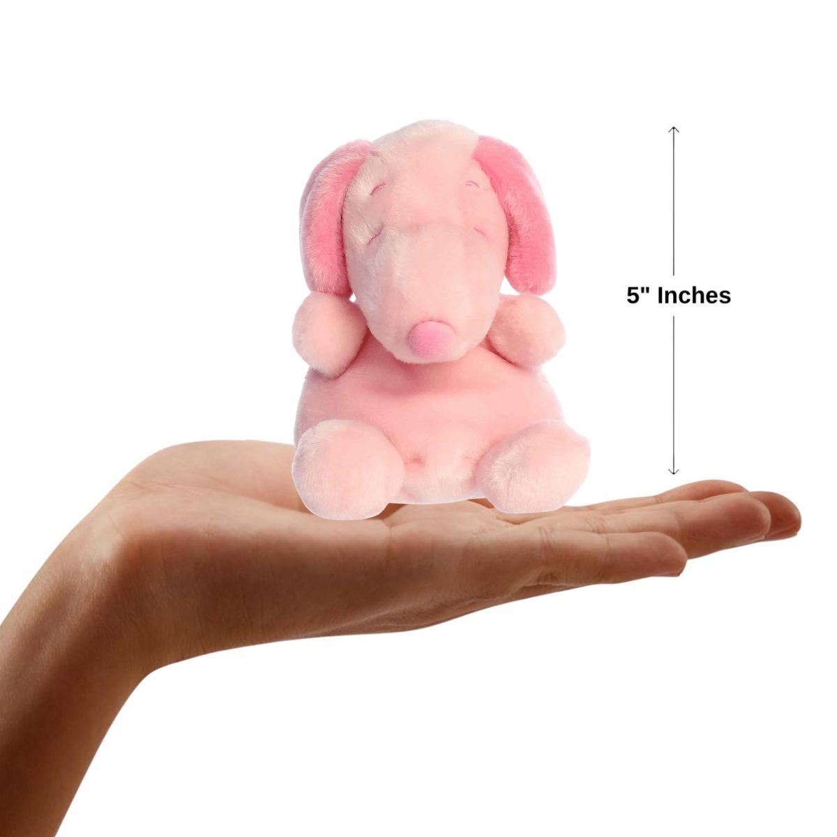 Dimension graphic showing the 5-inch Aurora Palm Pals Pink Snoopy resting comfortably in a person's hand.
