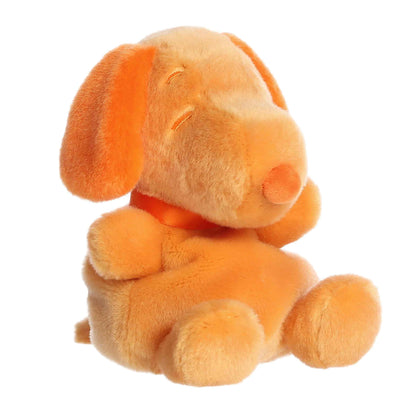 Front angled view of the 5-inch Aurora Palm Pals Peanuts Snoopy Color Collection plush toy featuring a pale orange body with bright orange ears and nose.