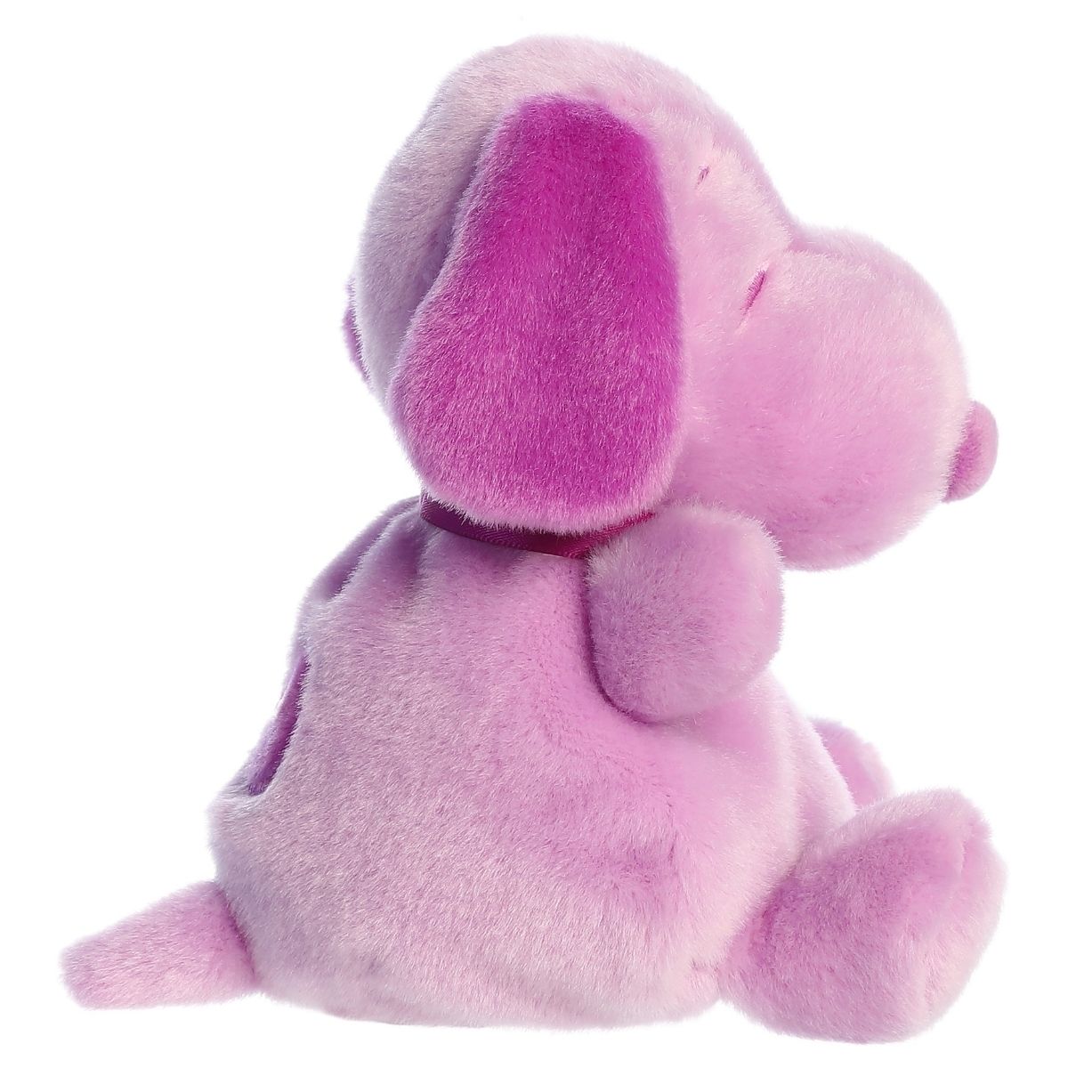 Side profile view of the Palm Pals Snoopy highlighting his plump shape, dark purple floppy ear, and back spot.