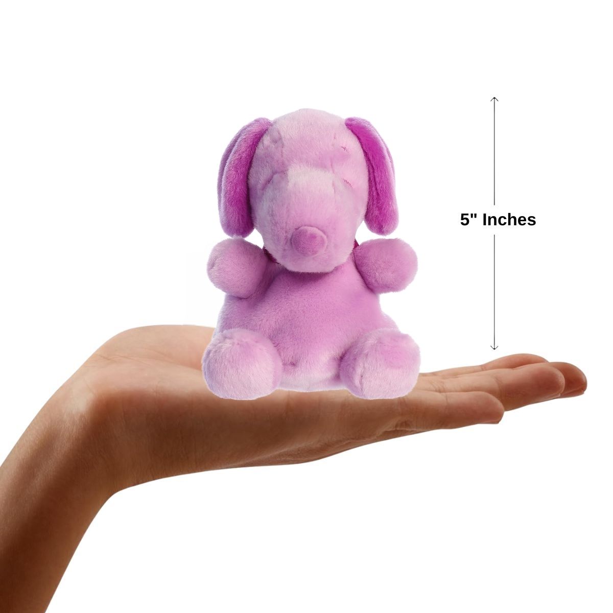 Sizing graphic showing the 5-inch Palm Pals Purple Snoopy plush sitting perfectly in the palm of a hand to demonstrate its small scale.