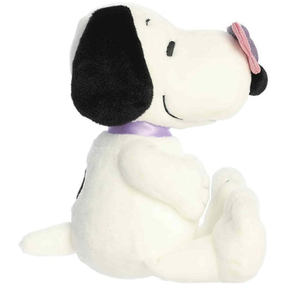 Side profile view of the cuddly Snoopy plush sitting comfortably, highlighting the butterfly and purple collar.