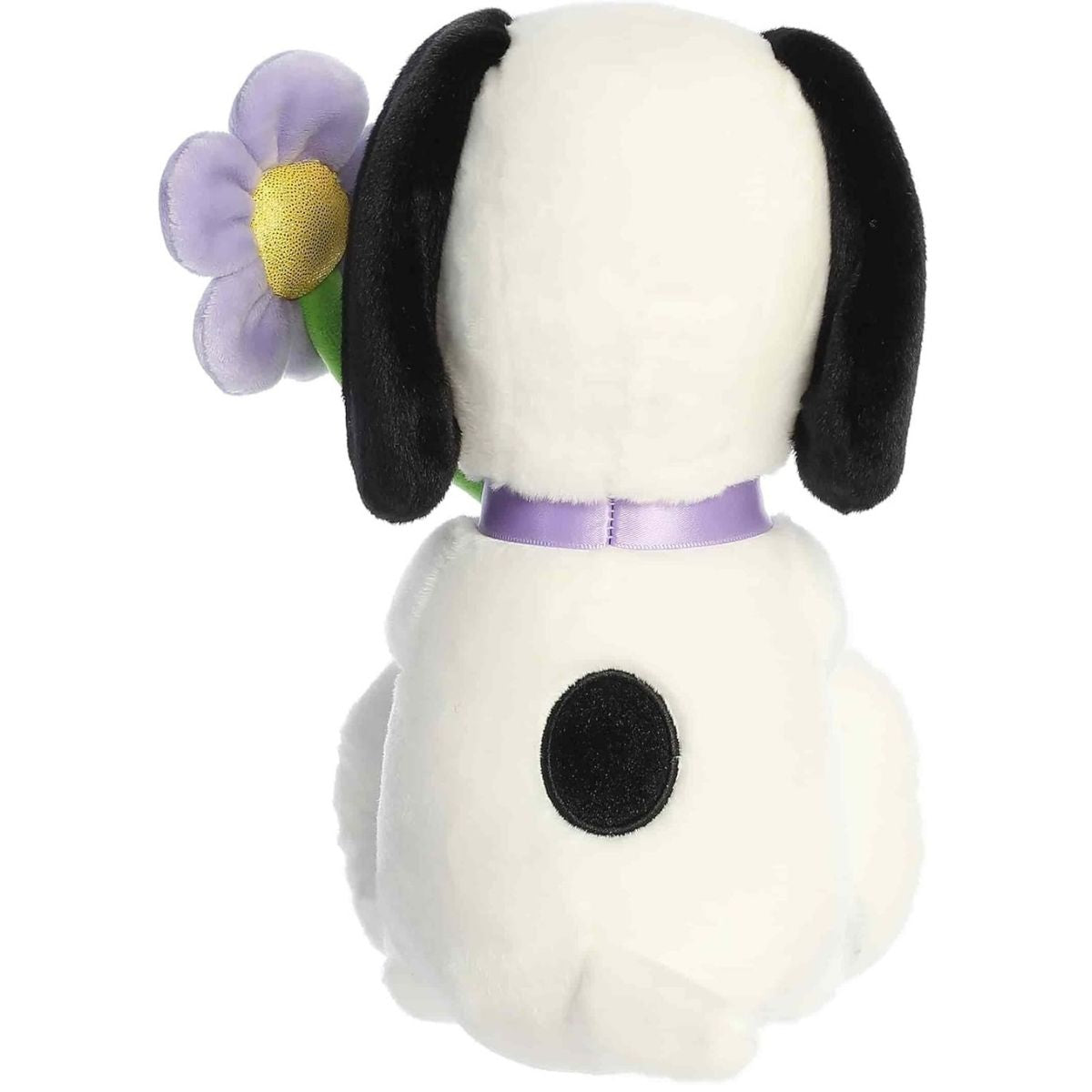 Direct back view of the Snoopy stuffed animal sitting down, highlighting the black spot on his back.