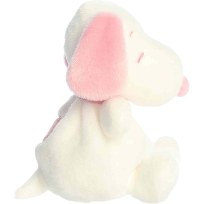 Side profile view of the white and pink Aurora Palm Pals Snoopy highlighting its sitting pose and pastel pink collar.