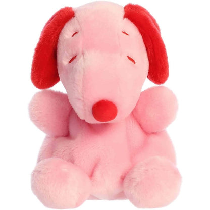 Straight-on front view of the soft Palm Pals Snoopy plush showing its closed happy eyes and red nose.