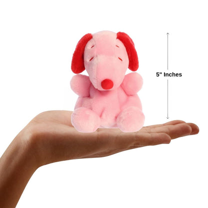 Dimension graphic showing the 5-inch pink and red Aurora Palm Pals Snoopy resting comfortably in a person's hand.