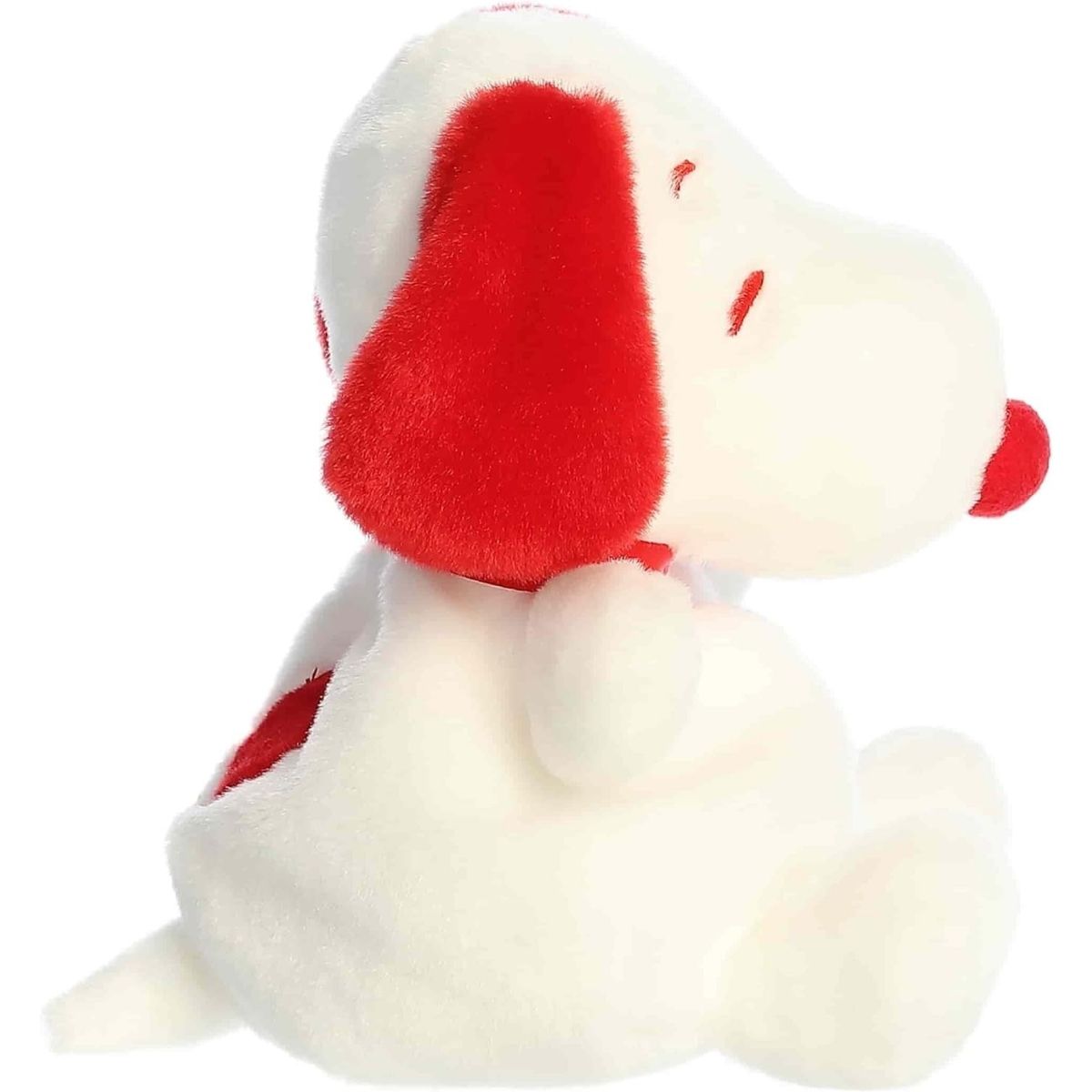 Side profile view of the Palm Pals Snoopy highlighting his plump shape, red floppy ear, and red spot on his back.