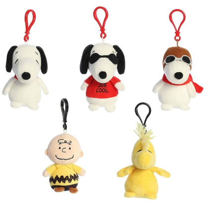 Angled view of the adorable Aurora Peanuts surprise plush clip-on collection showing their sweet faces and classic character details.