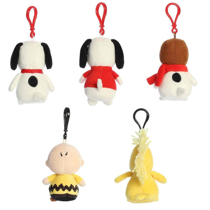 Back view of the Aurora Peanuts clip-on plush toys showing their soft backs, tails, and the sturdy plastic backpack clips.
