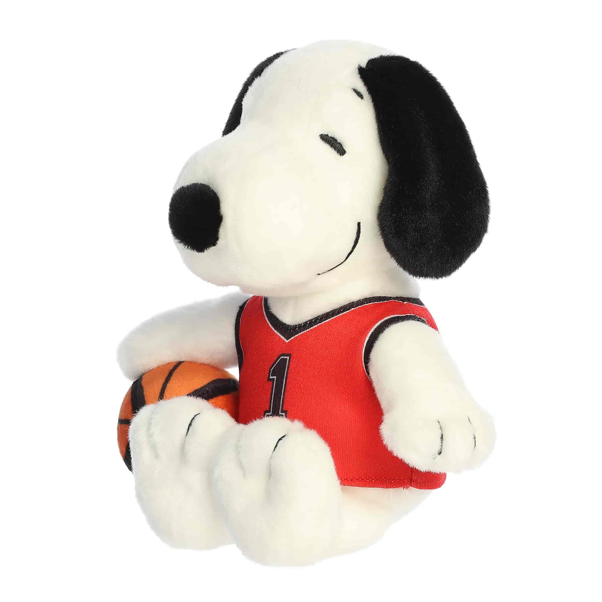 Angled front view of the Snoopy plush toy sitting and looking to the side, ready for tip-off.