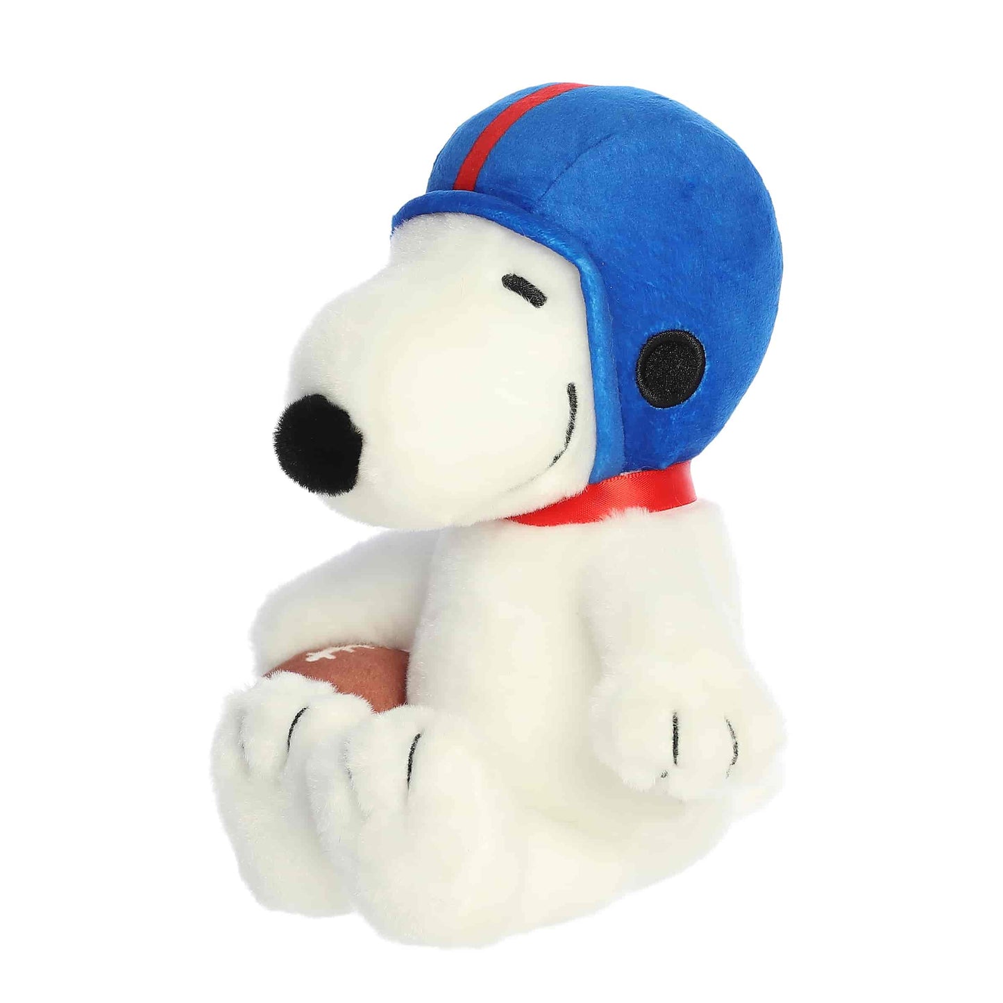 Angled front view of the Snoopy plush toy sitting and looking to the side, ready for the big game.