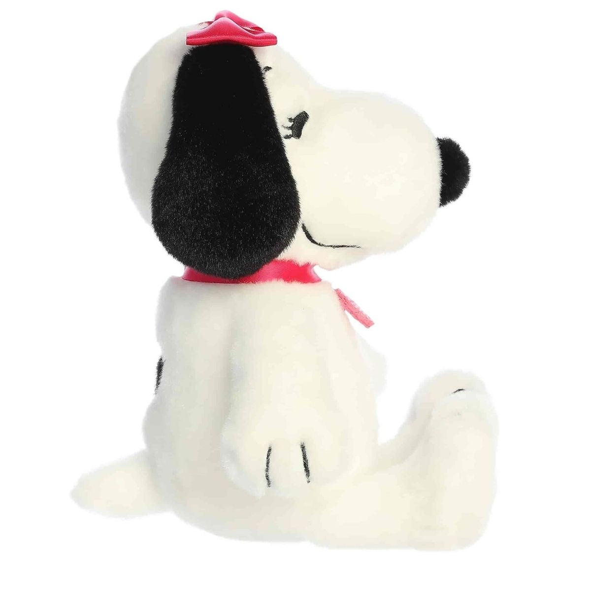 Side angle of the Snoopy's sister Belle toy emphasizing her seated posture and rounded snout.