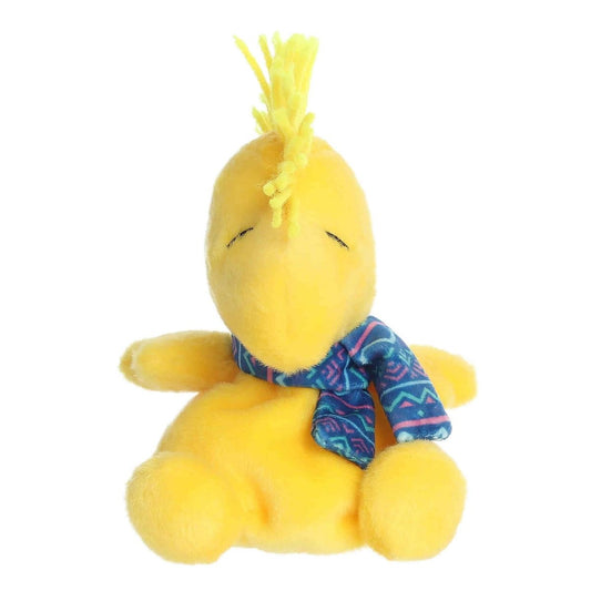 Straight front view of the 5-inch Woodstock stuffed animal highlighting his embroidered closed eyes and yellow spiky hair.