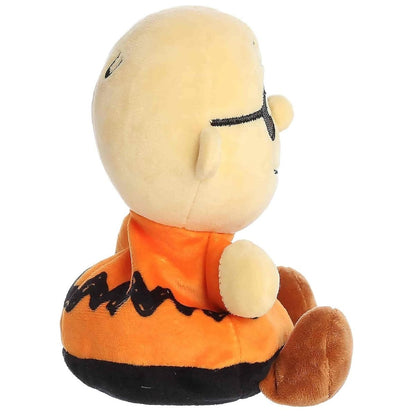 Side profile thumbnail of the mini Charlie Brown plush showcasing his round bald head, profile of the black mask, and soft seated posture.
