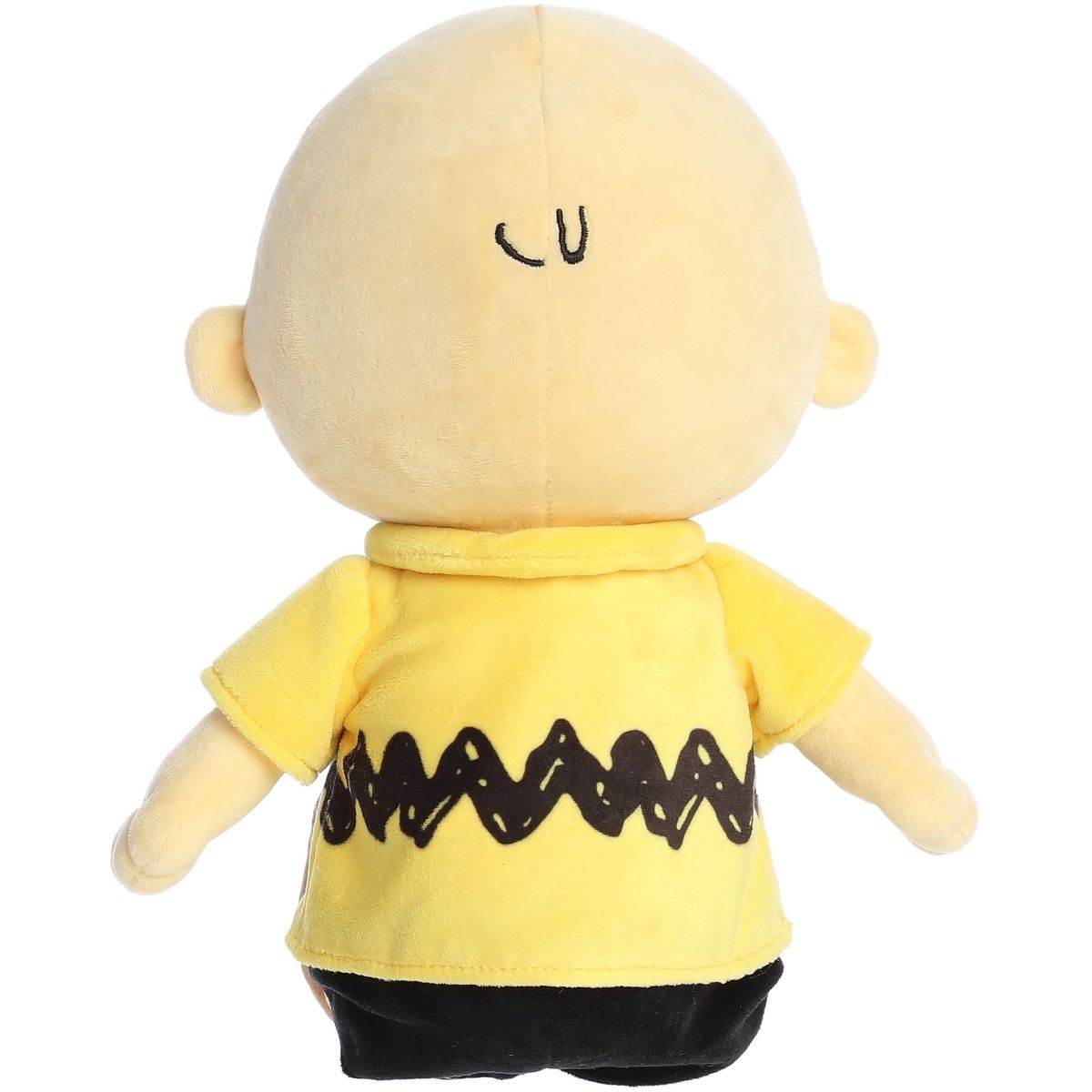 Direct back view of the cuddly Charlie Brown stuffed animal sitting down, showing his yellow shirt.