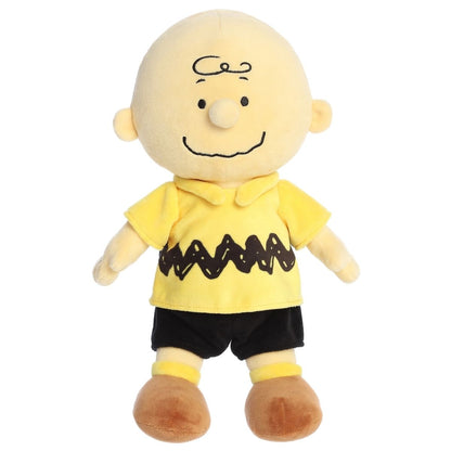 Straight-on front view of the 13-inch Aurora Peanuts Charlie Brown plush standing up tall.