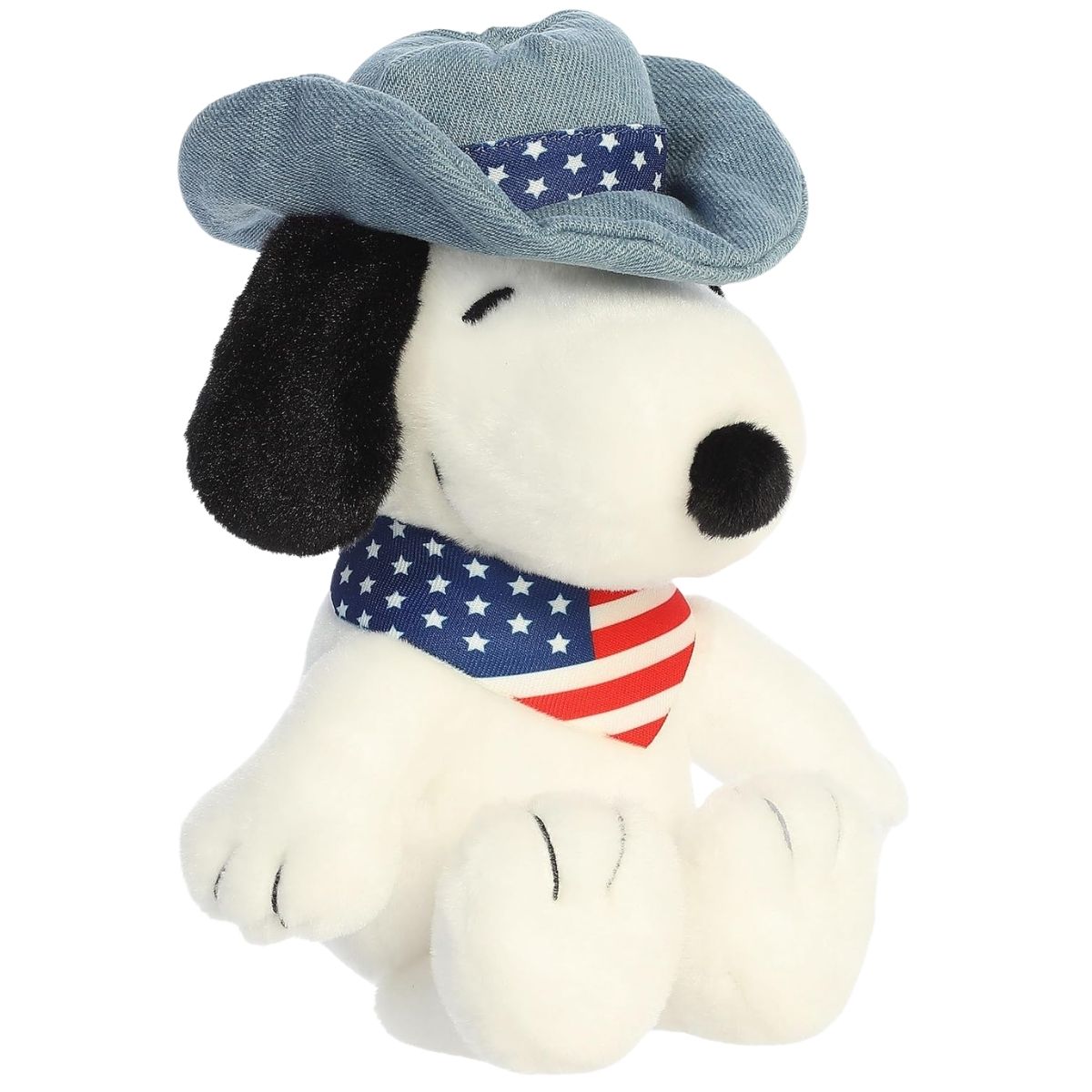 Aurora 8-inch Peanuts Americana Snoopy plush toy sitting forward wearing a denim-look hat with stars and a red, white, and blue striped bandana.