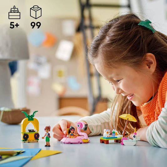 Child playing with toy figures on a table, with a blurred indoor background