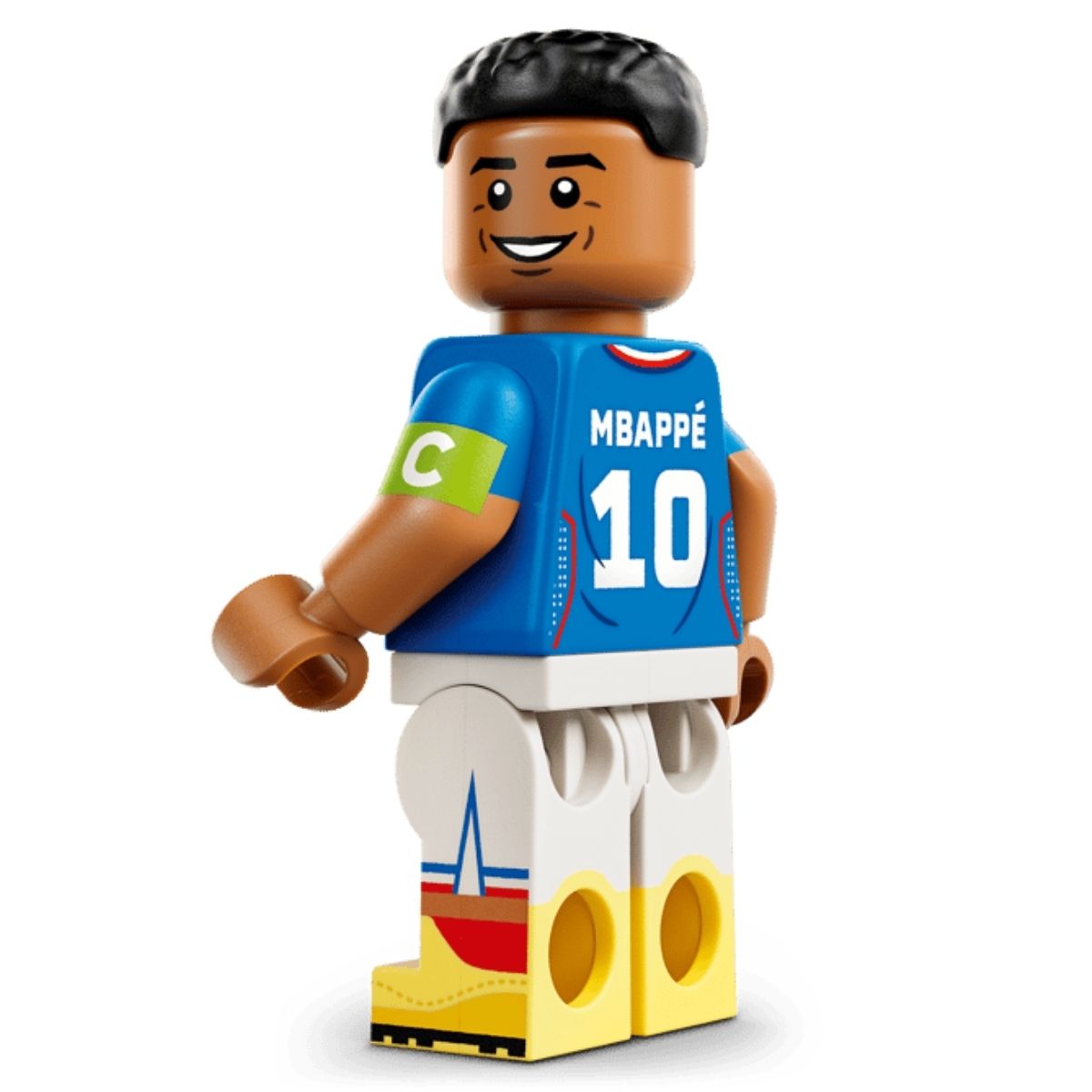 Close-up rear shot of the LEGO® Kylian Mbappé minifigure showing his blue France jersey with number 10 and white shorts.