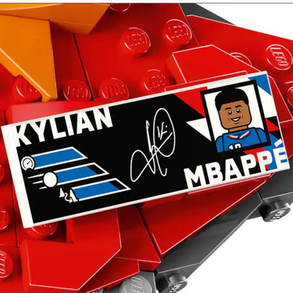 Close-up shot of the printed LEGO® player stat plaque displaying Kylian Mbappé's name, stats, and signature.