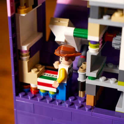 The interior of the purple LEGO® book opened up to showcase the Woody minifigure standing inside a secret room.