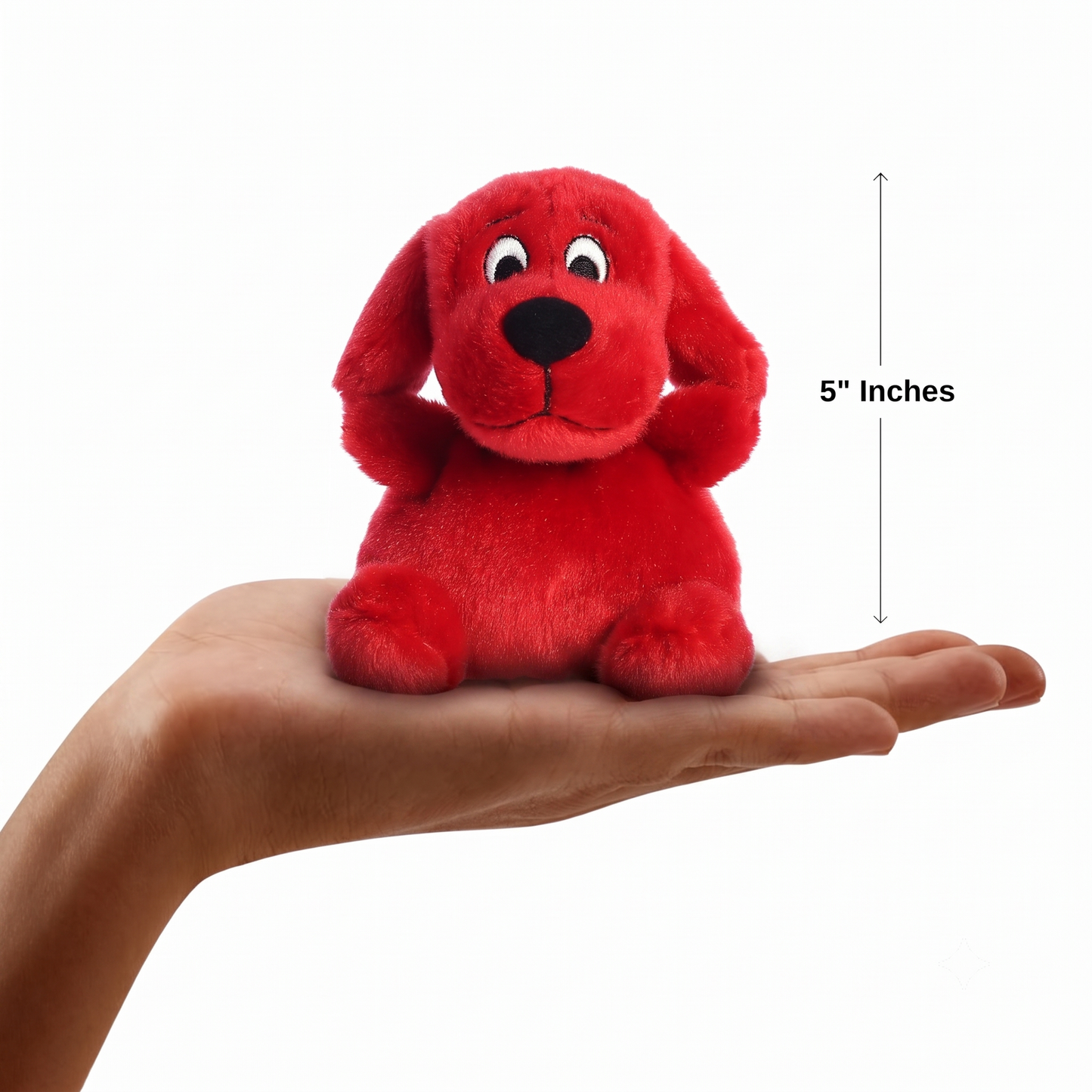 The miniature Clifford the Big Red Dog plush sitting balanced in an open human hand under a 5-inch height graphic indicator.