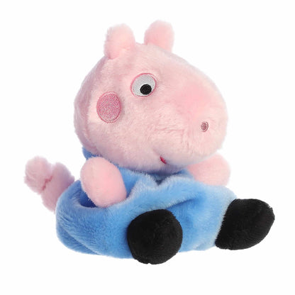 Aurora Palm Pals George Pig 5-inch plush stuffed toy sitting angled forward with a pink head and a classic blue shirt.