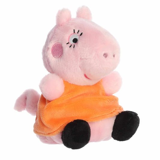 Aurora Palm Pals Mummy Pig 5-inch plush stuffed toy sitting angled forward with a pink head and a vibrant orange dress.