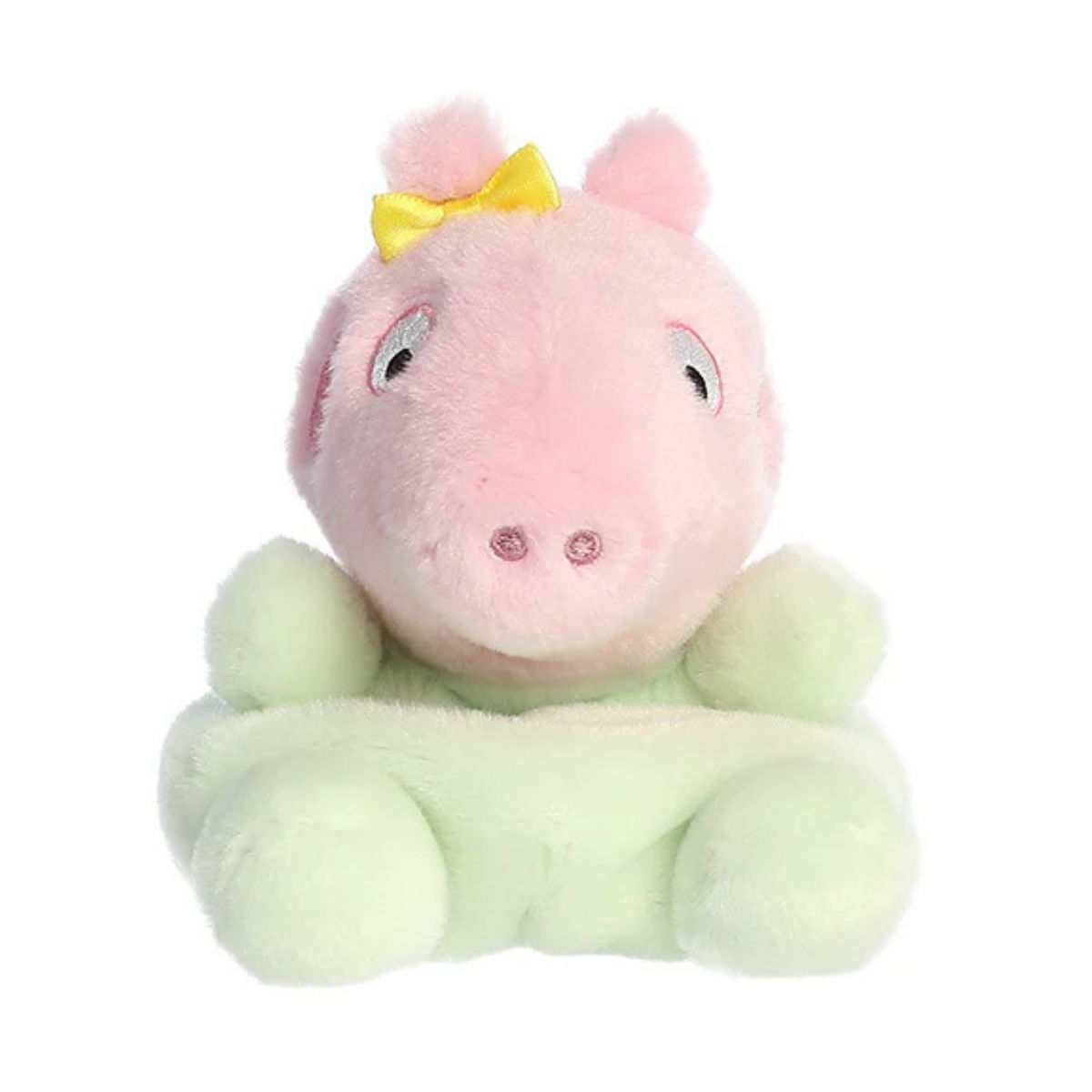 Straight front view of the sitting Baby Evie plush showing her pink snout, sweet smile, and pastel green onesie.
